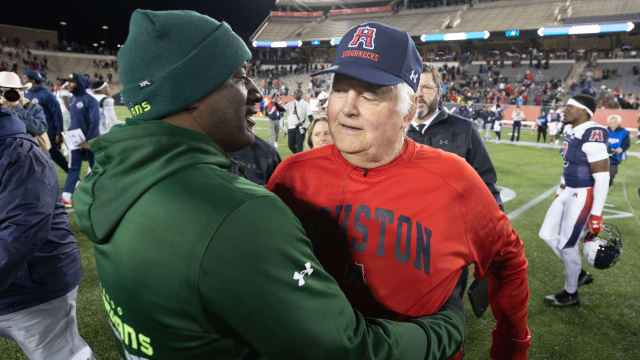 Feb 18, 2023; Houston, TX, USA; Houston Roughnecks head coach Wade Phillips hugs Orlando Guardians head coach Terrell Buckley after the Roughnecks defeated the Guardians at TDECU Stadium. Mandatory Credit: Thomas Shea-USA TODAY Sports 